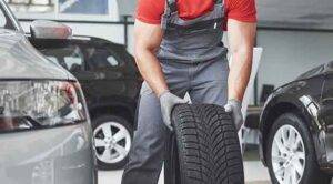 A mechaninc holding a tire